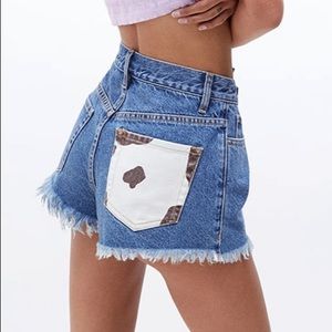 Denim shorts with cow print pocket